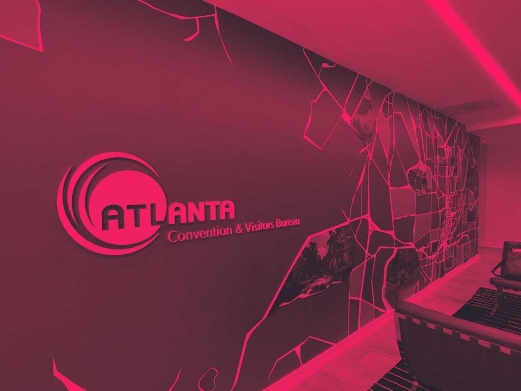 atlanta convention & visitors bureau logo on a wall mural in an office